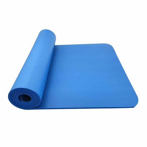 Blue yoga mat rolled out on a white background