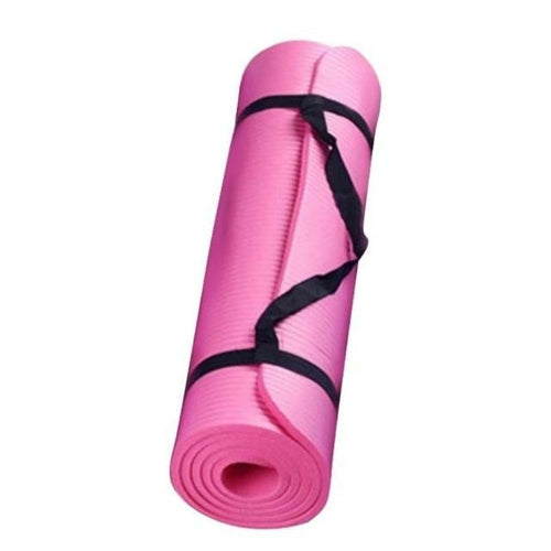Pink yoga mat with a black strap on a white background