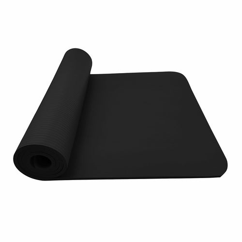 Black yoga mat rolled out on a white background
